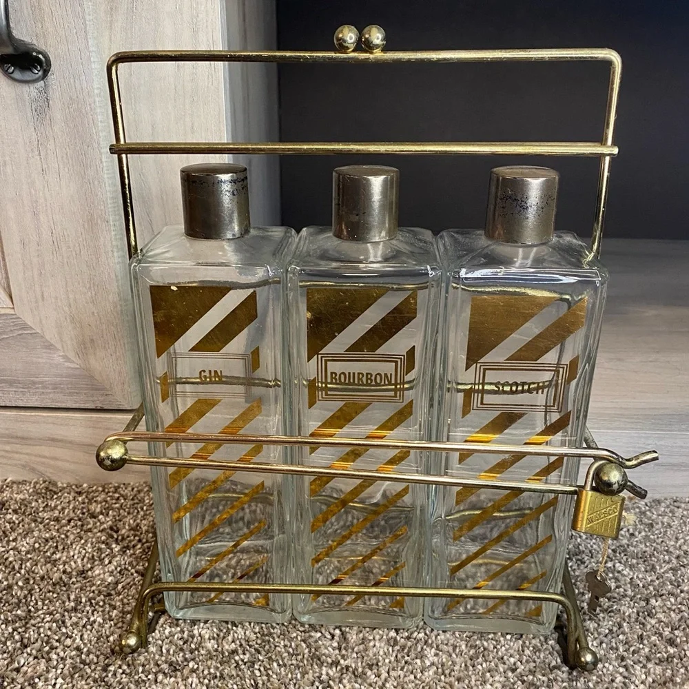 Vintage Decanter with Caddy, three bottle tantalus w Scotch, Bourbon Gin Labels